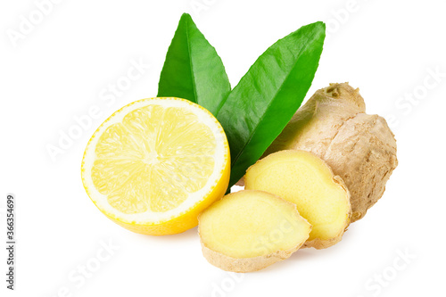ginger roots with slices, green leaves and lemons isolated on white background