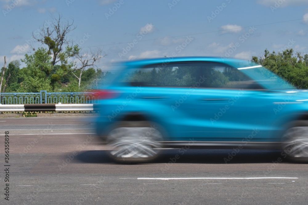 motion blurred SUV at high speed on highway