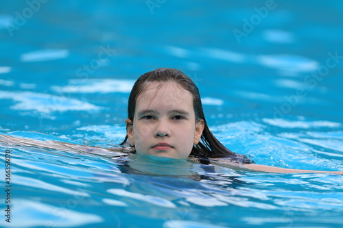 portrait of a young girl in the pool