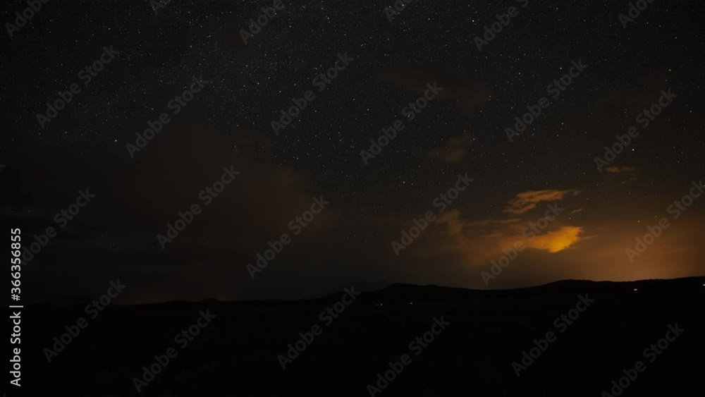 Time lapse of a clearing rainstorm at night revealing the stars Time lapse of a clearing rainstorm at night revealing the stars