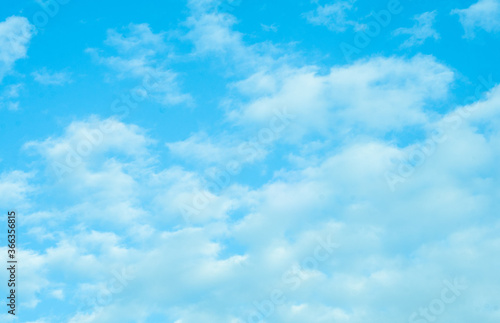 Blue sky with white Cumulus clouds. Atmosphere. Background. Natural phenomenon. 