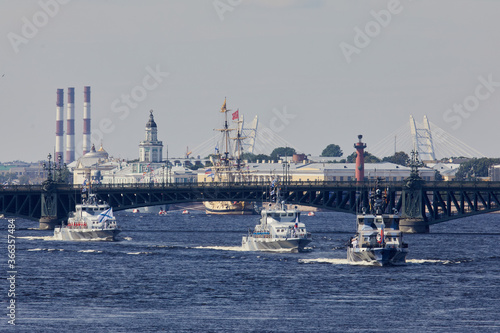 View of Russian Navy, modern russian military naval battleships warships in the row, northern fleet and baltic sea fleet, summer sunny day during the military exercise © tsuguliev