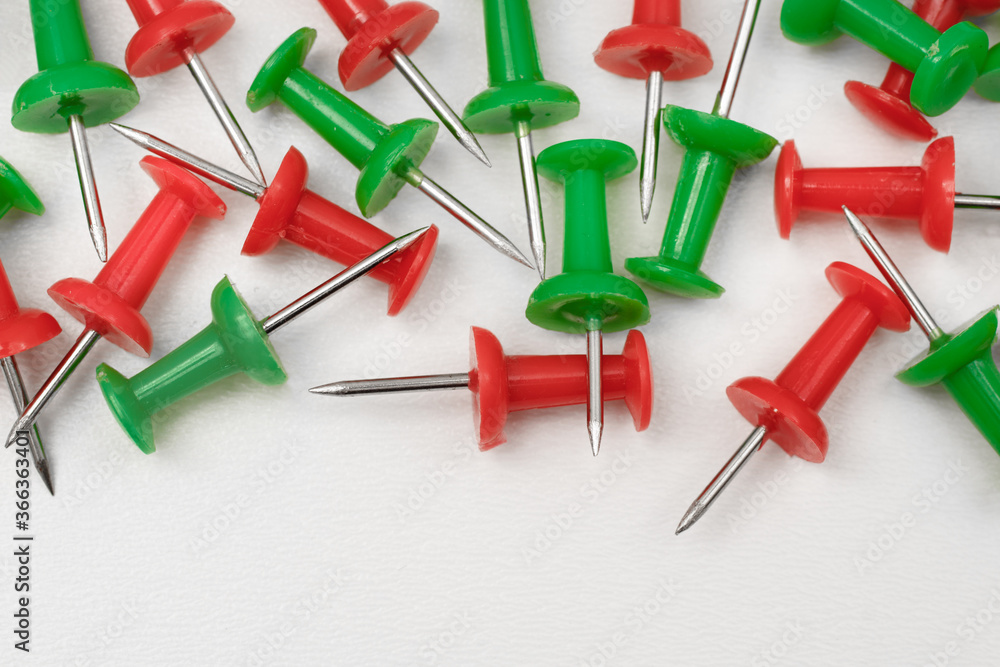 Red and Green thumbtacks with copy space Red and Green thumbtacks with copy space