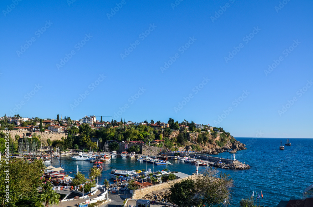 View of the of yacht harbor and red house roofs in the old town of Kaleici in Antalya, Turkey