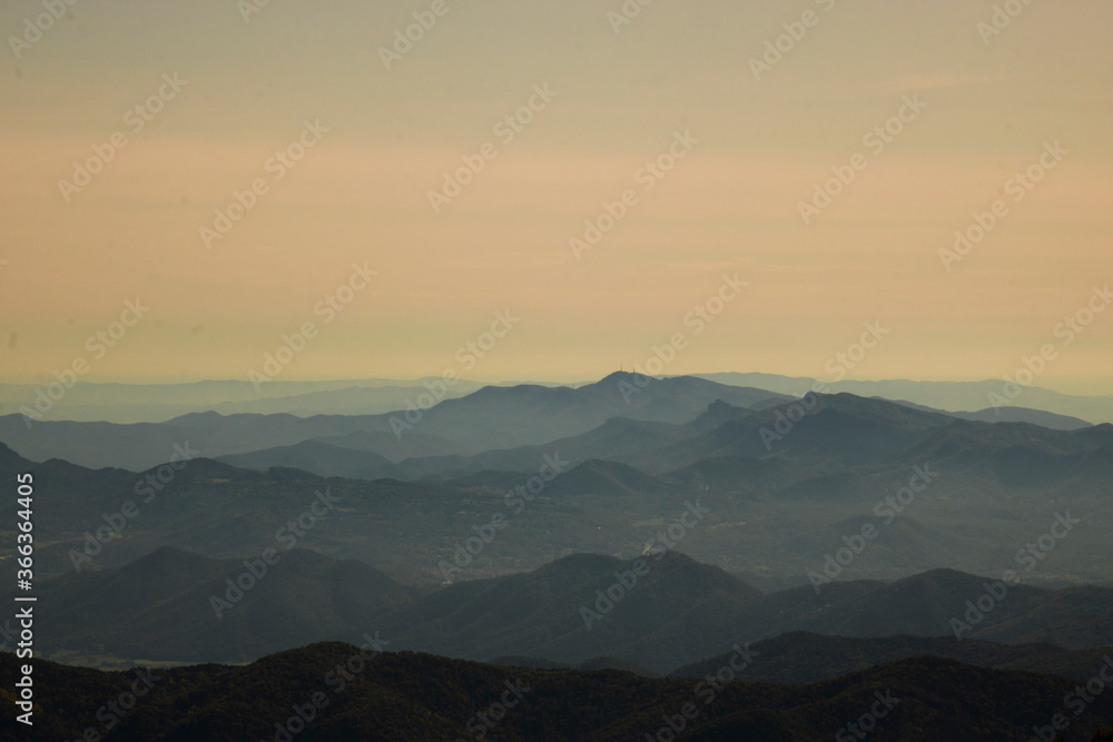 Layers of mountains under a clear sky