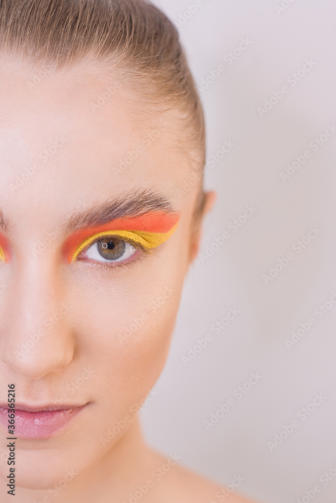 Step-by-step instructions on how to make a bright art makeup for a butterfly at home. DIY. Step 4. Applying a yellow arrow from below to the eyelid, paint under the eyebrow with orange shadows. Step-by-step instructions on how to make a bright art makeup for a butterfly at home. DIY. Step 4. Applying a yellow arrow from below to the eyelid, paint under the eyebrow with orange shadows.