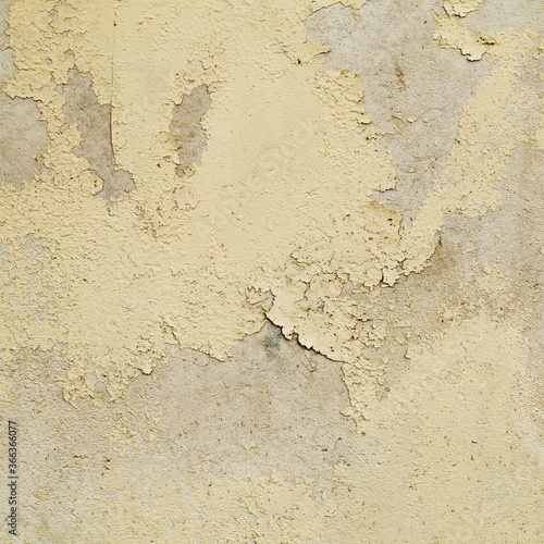 Great colorful background or texture. Abstract concrete aged with cracks, scratches and remnants of old paint in different shades. Bully smeared paint on the walls of an old building. Rough surface 