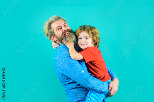 Family time. Dad and son. Family relationships. Parentship concept. Dad hugs with son. Bearded man with little boy.