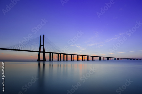 Sunrise at Vasco da Gama Bridge, the longest bridge in Europe, who spans the Tagus River, in Lisbon, Portugal. © Aron M  - Austria