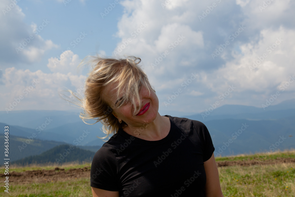 girl portrait on a background of mountains
