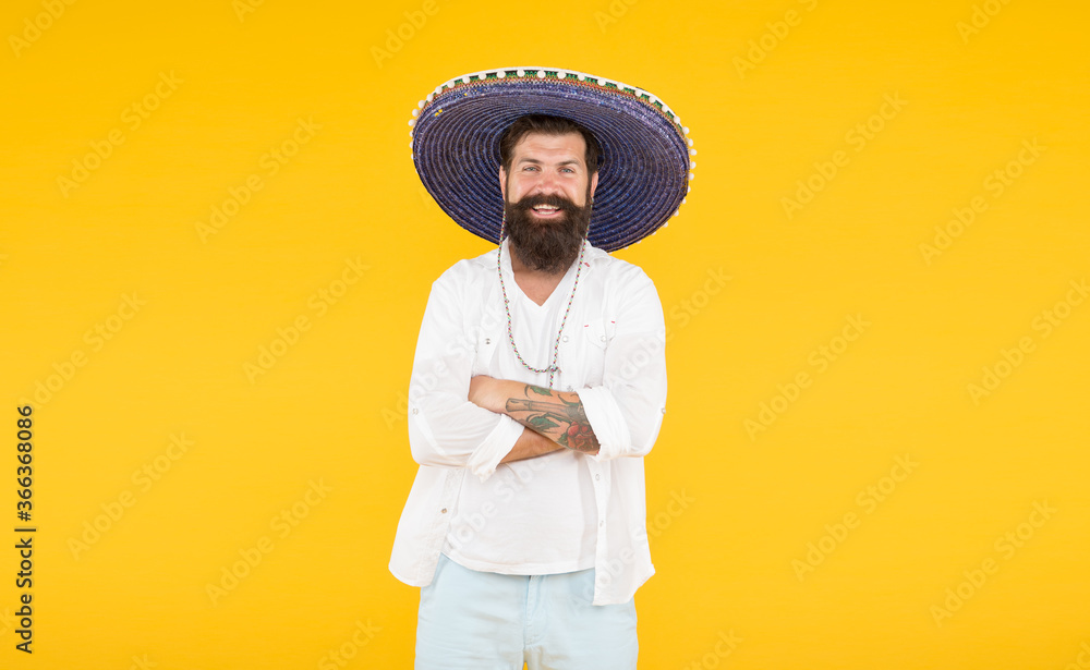 man in mexican sombrero hat. vacation concept at resort in mexico. hipster with beard looks festive in sombrero. happy brutal male celebrating fiesta. guy wear poncho. sombrero party man man in mexican sombrero hat. vacation concept at resort in mexico. hipster with beard looks festive in sombrero. happy brutal male celebrating fiesta. guy wear poncho. sombrero party man