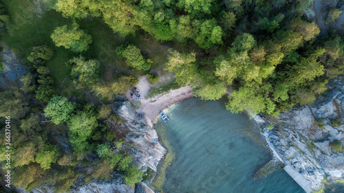 Aerial drone photo of beautiful island bay with blue clear water and boat. Saaristomeri. Finland photo