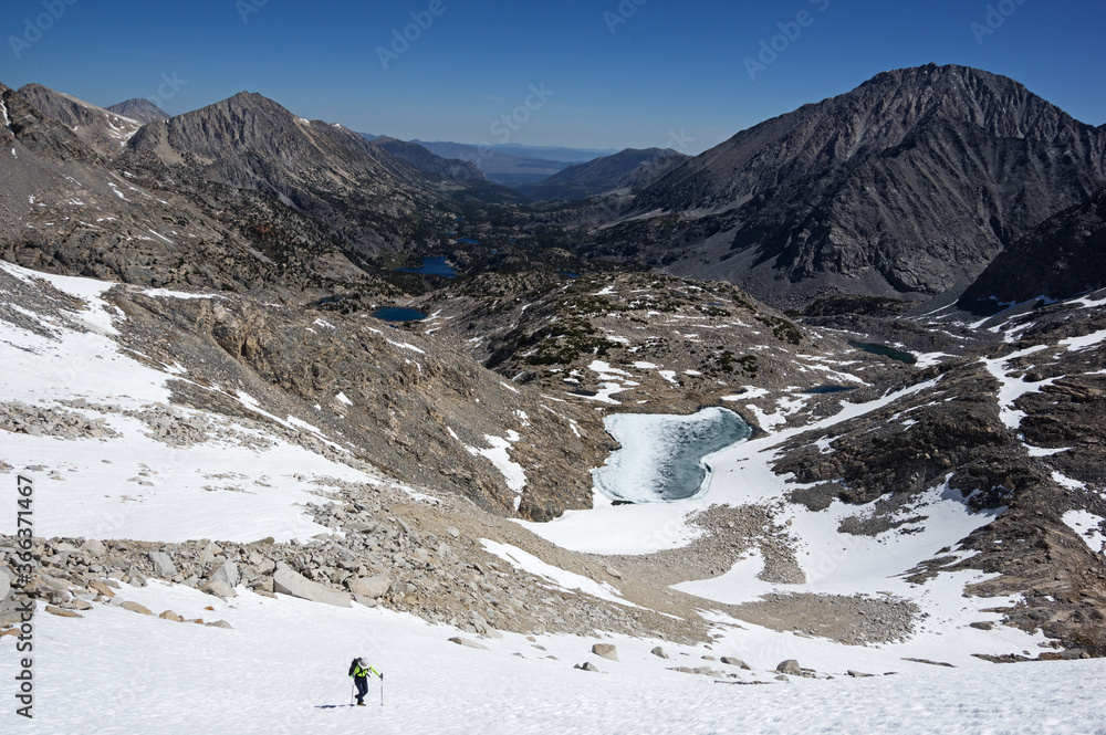 Woman Climbs Up Snowfield