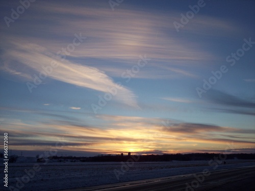 Rural Minnesota snowy fields at sunset 