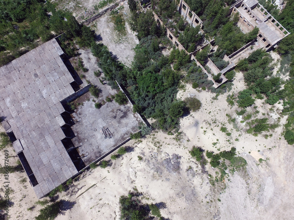 Obraz premium Drone quadrocopter explores an abandoned industrial building.Kiev