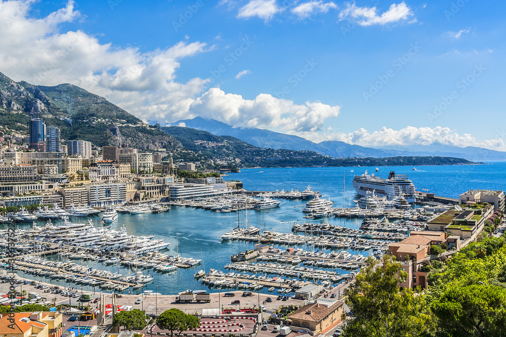 Panoramic view on excellent residential buildings and marina in Monte Carlo, Monaco. Principality of Monaco is a sovereign city state, located on the French Riviera in Western Europe.