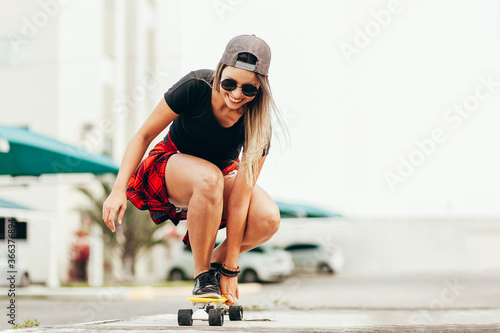 Young woman skateboarding in the city