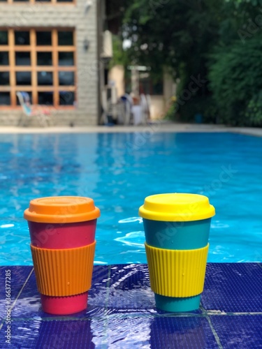 reusable bamboo mug at the swimming pool