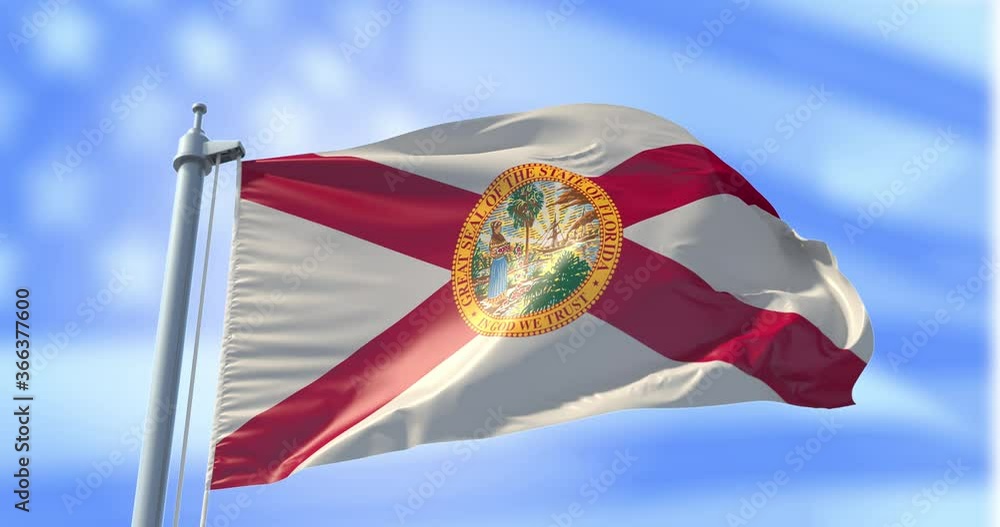 Florida flag on a flagpole on USA flag background waving in the wind in