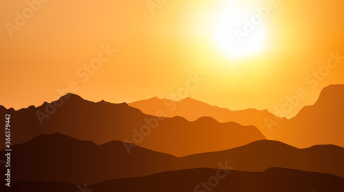 mountains at sunset in orange tones