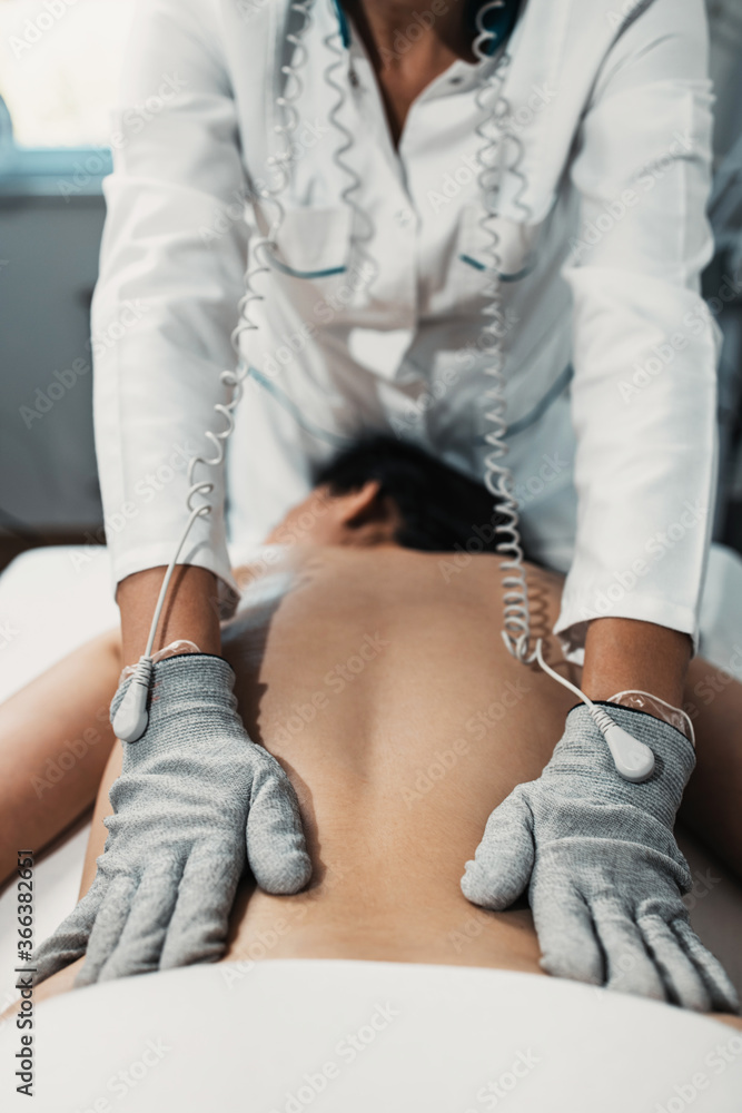 Micro sensory electrical BIO EMS microcurrent treatment for face and body electro stimulation and muscle toning. Anti wrinkle and anti-aging lifting. Alternative therapy with conductive gloves. Micro sensory electrical BIO EMS microcurrent treatment for face and body electro stimulation and muscle toning. Anti wrinkle and anti-aging lifting. Alternative therapy with conductive gloves.