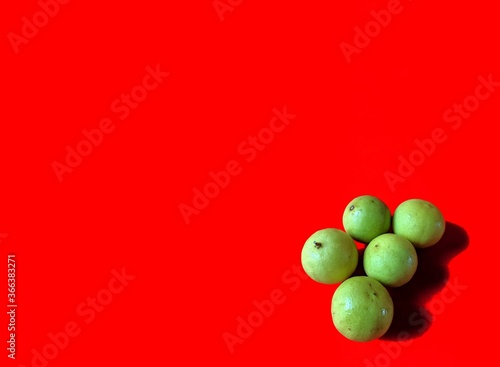 Yellow lemons on red background. healthy food concept