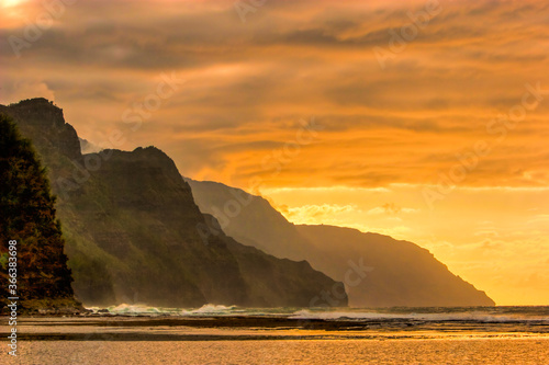 The Na Pali headlands in a sunset on the north shore of Kauai, Hawaii. photo