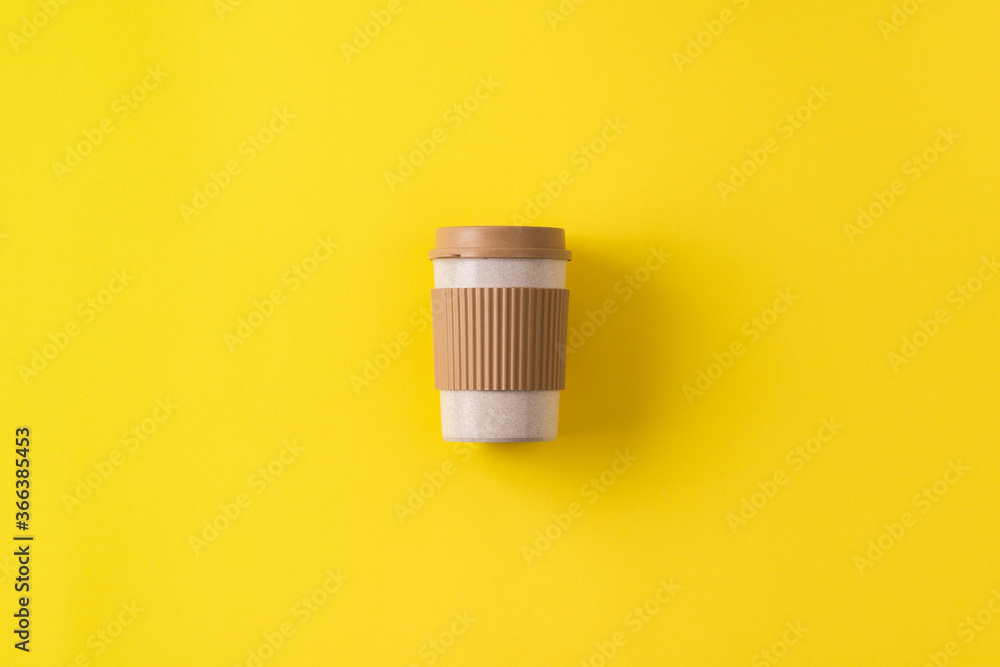 Reusable portable coffee mug. Travel coffee cup with spill stopper to go. Sustainable organic bamboo fiber tumbler. Eco friendly, plastic free. Minimal zero waste concept, flat lay, copy space. Reusable portable coffee mug. Travel coffee cup with spill stopper to go. Sustainable organic bamboo fiber tumbler. Eco friendly, plastic free. Minimal zero waste concept, flat lay, copy space.