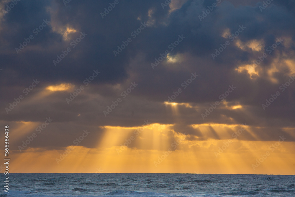 Cloudy sunset with sun rays at Seaside, Oregon Cloudy sunset with sun rays at Seaside, Oregon