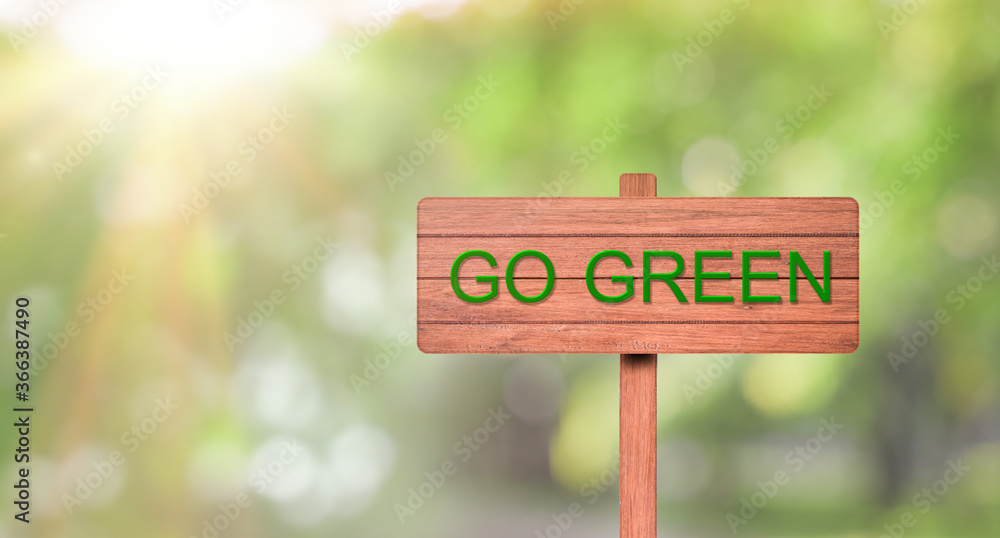 Environment concept. wooden sign with word Go Green over green background