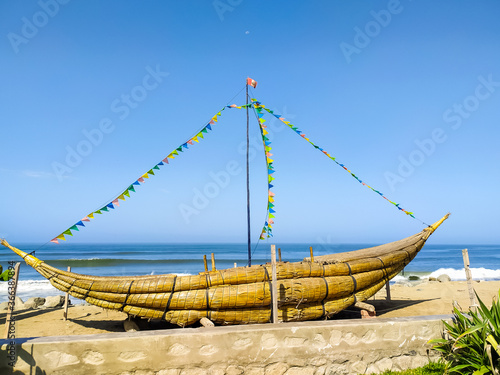 Traditional reed boats in the city of Huanchaco in Peru photo