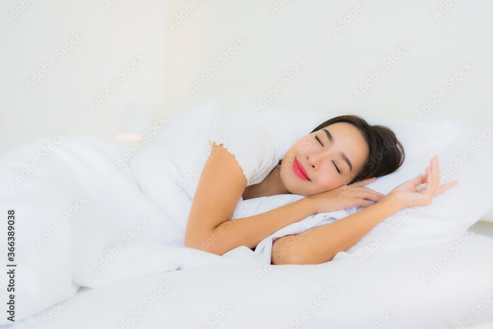 Portrait beautiful young asian woman relax happy smile on bed with white pillow blanket Portrait beautiful young asian woman relax happy smile on bed with white pillow blanket
