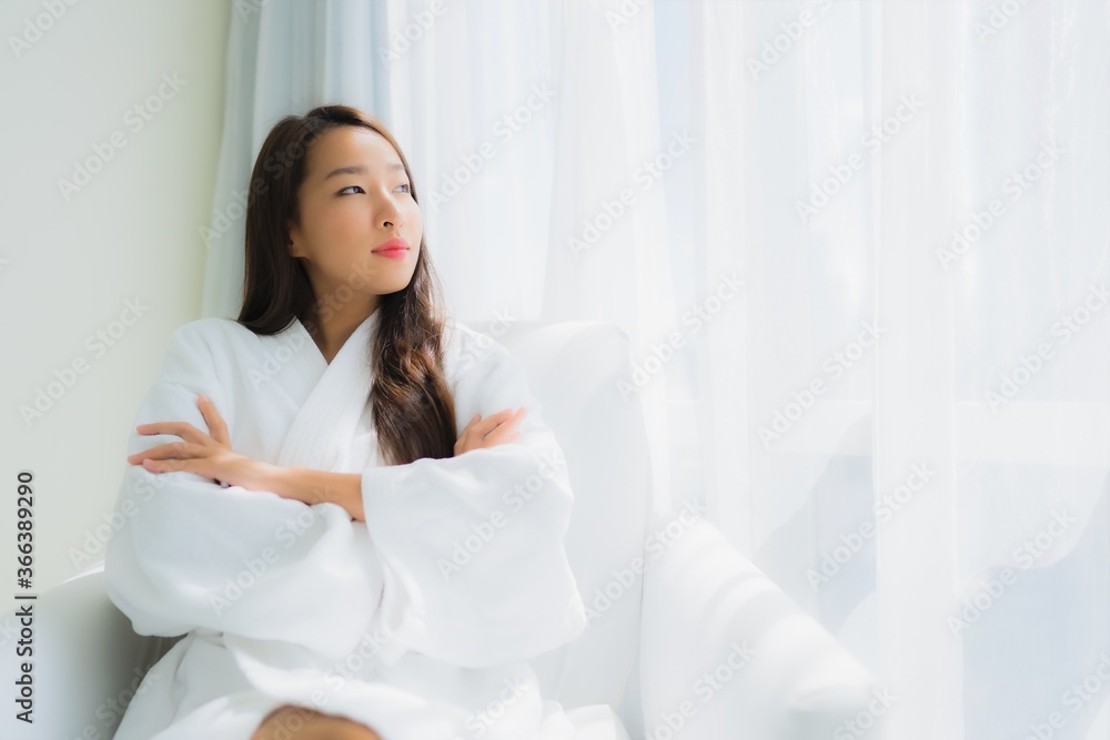 Portrait beautiful young asian woman relax happy smile with coffee cup on sofa Portrait beautiful young asian woman relax happy smile with coffee cup on sofa