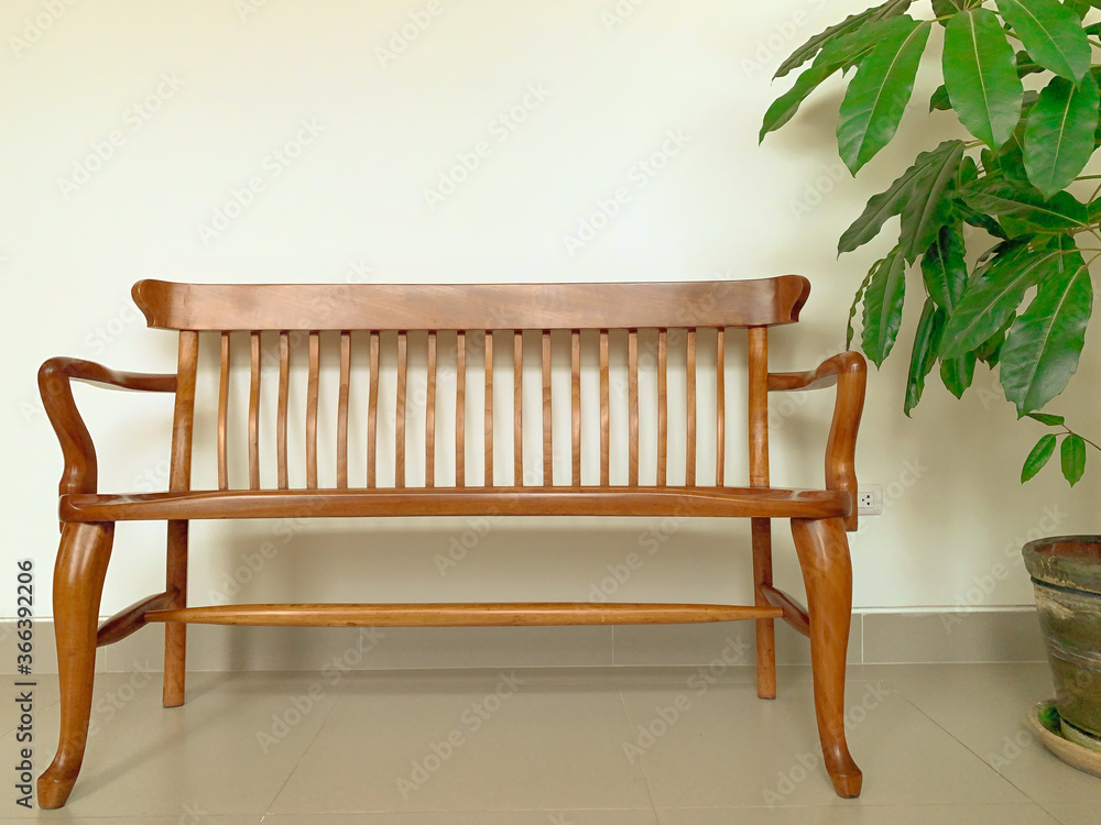 Wooden bench on a white background. Wooden bench in the wiating room. - obrazy, fototapety, plakaty 