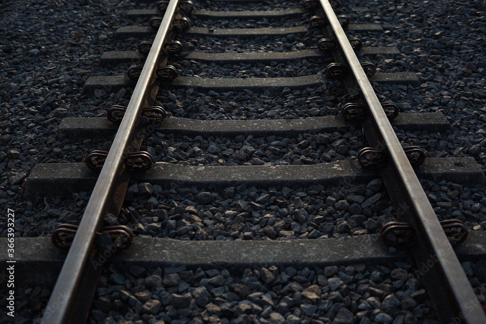 Close up and selective focus photo of railway track or railroad with morning sunlight. Close up and selective focus photo of railway track or railroad with morning sunlight.
