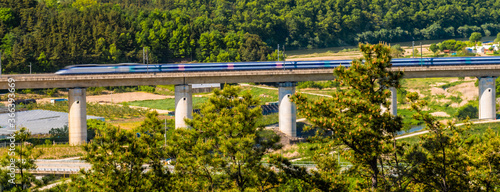 High speed train in rural countryside.