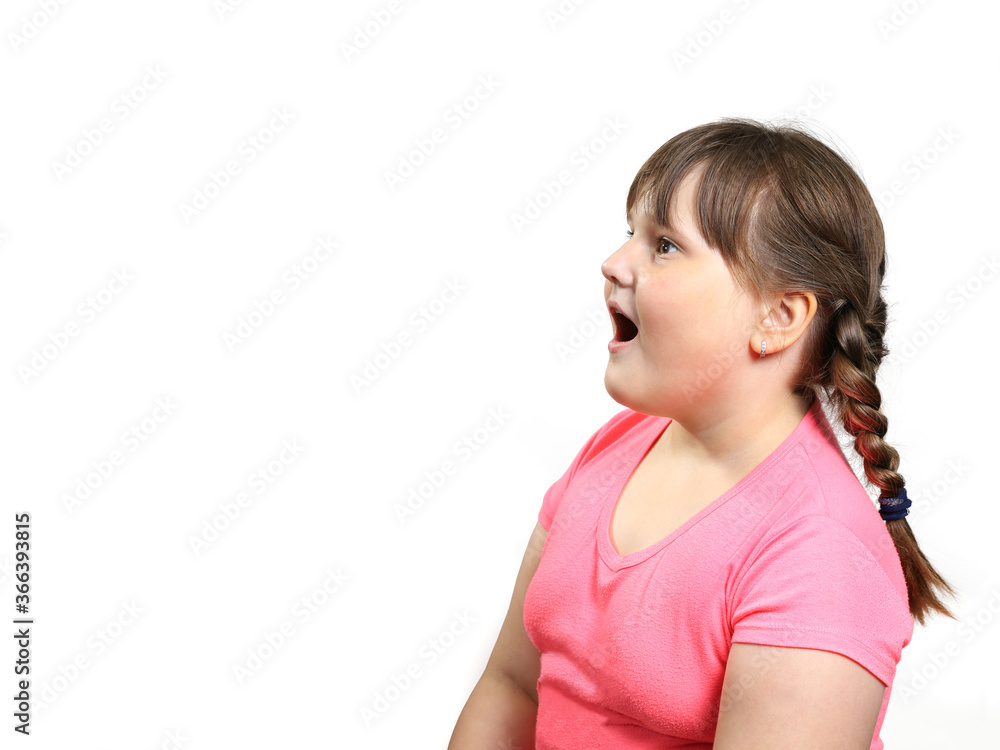 Plump girl opened her mouth in surprise and looks to the side of empty space. Isolated on white with copy space Plump girl opened her mouth in surprise and looks to the side of empty space. Isolated on white with copy space