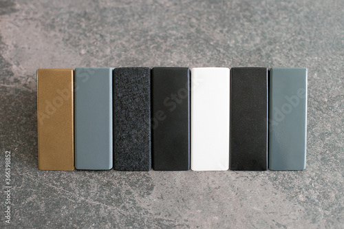 Samples of metal corners - a set of metal structures for the manufacture of furniture, tables, cabinets, shelves. Cutting surfaces, colors, stylish concept in gray colors photo