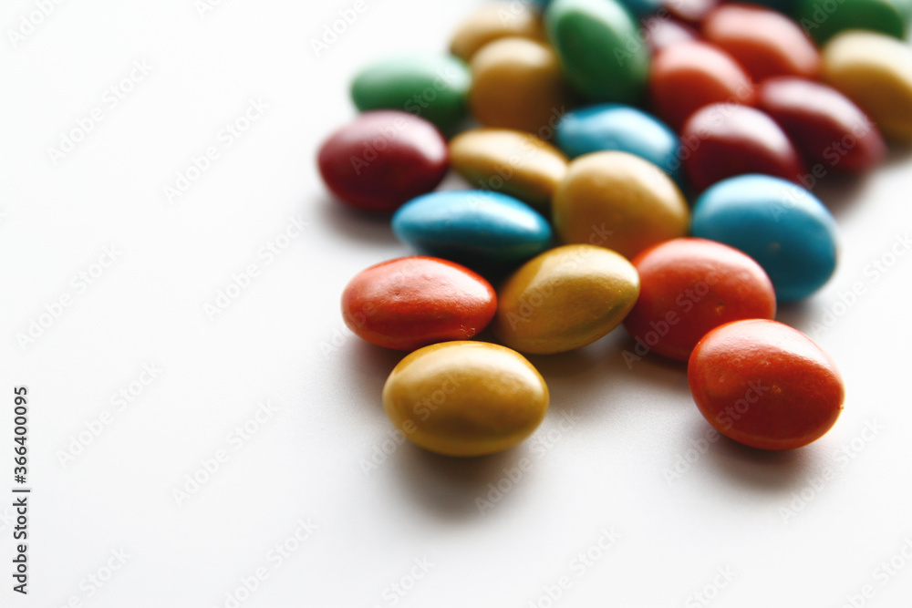 Colorful chocolate candy on white background Colorful chocolate candy on white background