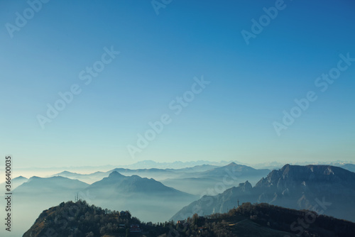 The natural scenery of Lecco in Italy, the Piani d'Erna with morning mist, stunning views of the Alps