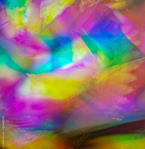 Psychedelic abstract background splash pattern. Trippy light exposure with swirling rainbow colors