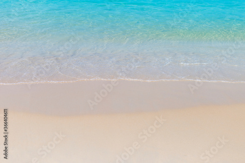 Clear blue sea water on clean fine sand beach  summer season concept  nature background  outdoor day light  clean environment