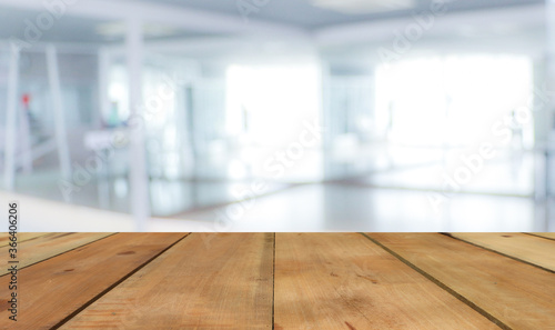 Wooden terrace with space for placing items or advertising media with a blurred white background