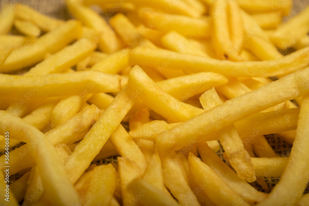 French fries scattered surface texture. Close up. French fries scattered surface texture. Close up.