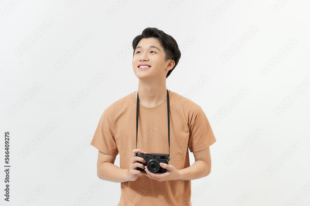 Laughing traveler tourist man in yellow casual clothes with photo camera Laughing traveler tourist man in yellow casual clothes with photo camera