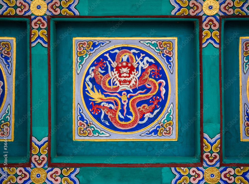Colorful Chinese temple decoration on the ceiling.