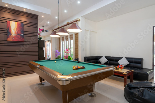 Interior design of modern house, home, villa feature pool table, shelve, sofa and television in living room