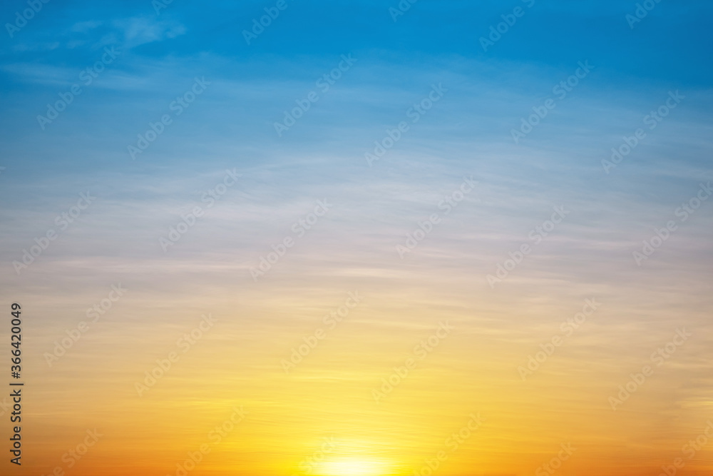 The morning sun under the colorful sky, warm horizon line