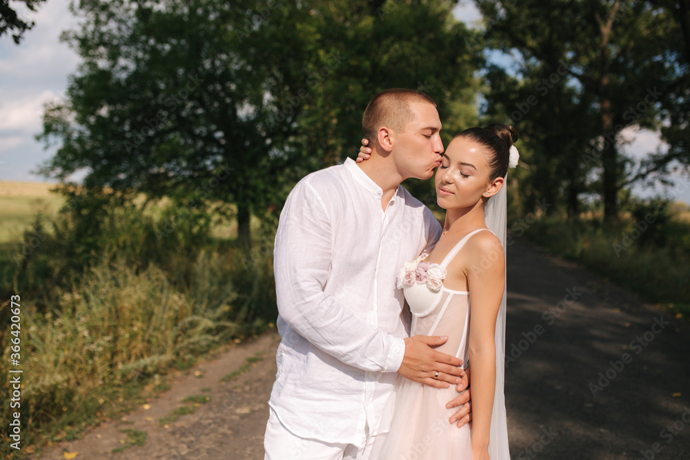 Portrait of groom and bride in their wedding day. Summer wedding Portrait of groom and bride in their wedding day. Summer wedding
