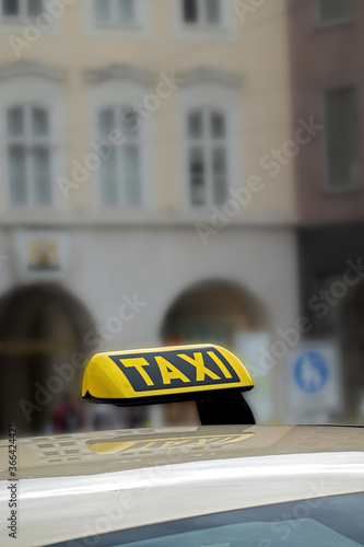 Taxi sign on a car